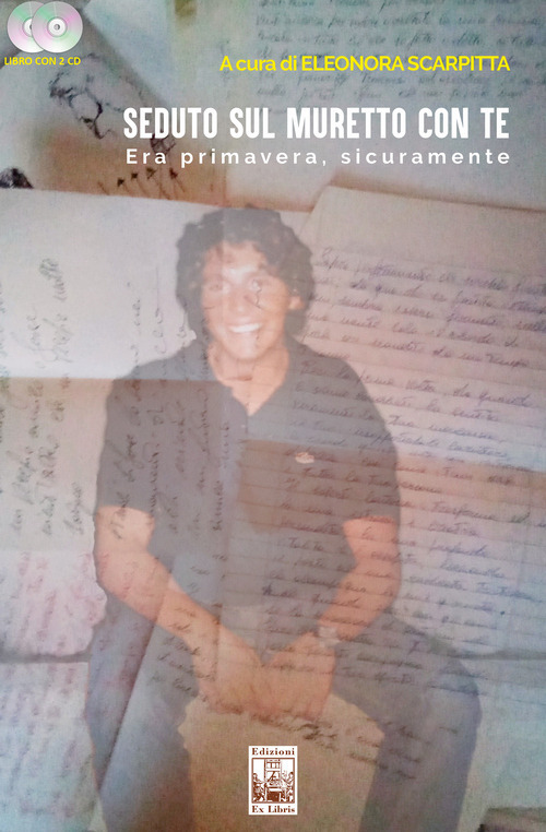 Seduto sul muretto con te. Era primavera, sicuramente